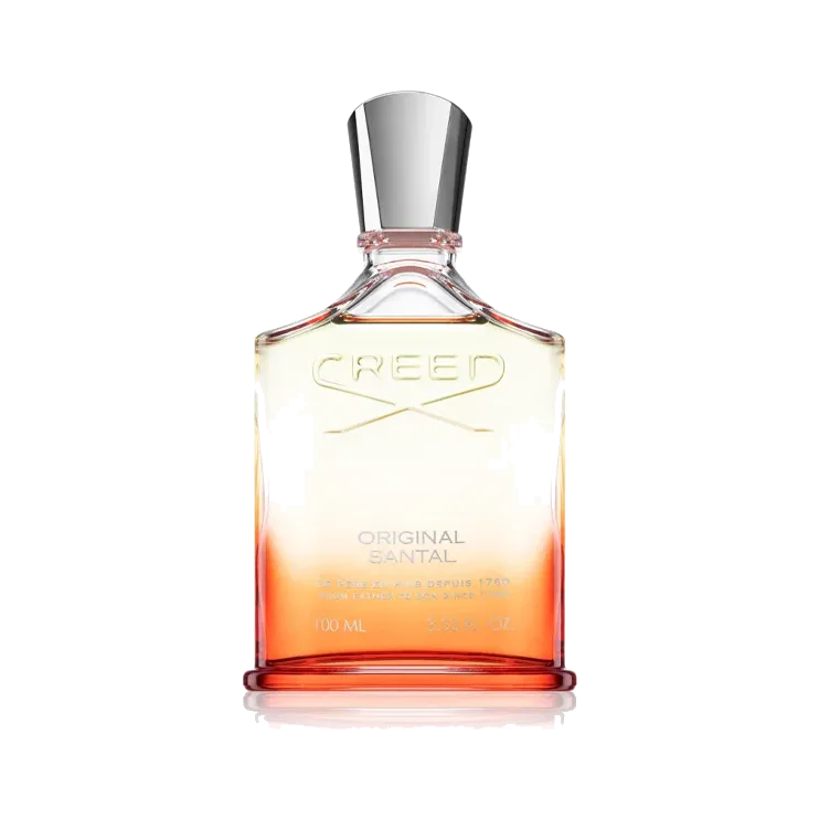 Frasco de hombros caídos con degradado de crema a coral, nombre grabado en el vidrio y tapón cónico de metal plateado, sobre fondo blanco.