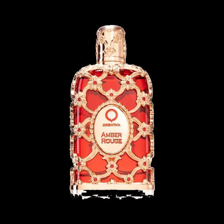 Frasco rectangular de vidrio rojo envuelto en una filigrana de metal en oro rosa con cabujones rojos y un medallón ovalado al frente, sobre fondo blanco.