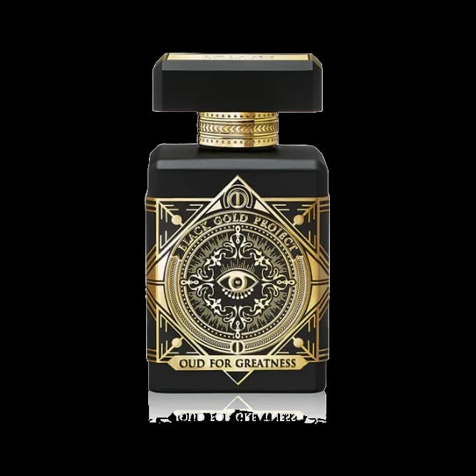 Frasco rectangular negro mate con un emblema dorado de ojo dentro de un rombo grabado en el frente y tapón negro y dorado, sobre fondo blanco.