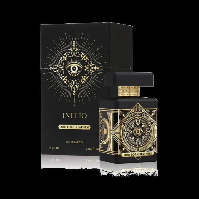 El frasco junto a su estuche negro con el mismo emblema dorado, ambos sobre fondo blanco.