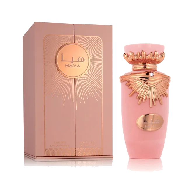 El frasco al lado de su estuche rosa con un sol grabado en oro rosa, ambos sobre fondo blanco.