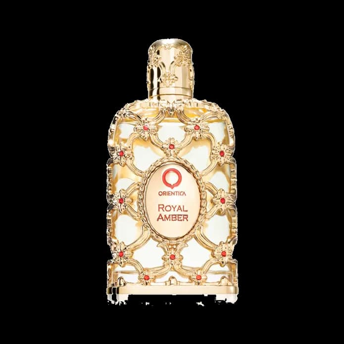 Frasco rectangular de vidrio blanco envuelto en filigrana dorada con cabujones rojos y un medallón ovalado al frente, sobre fondo blanco.